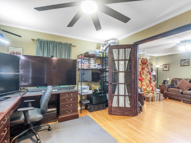 home office featuring light hardwood / wood-style floors and ornamental molding