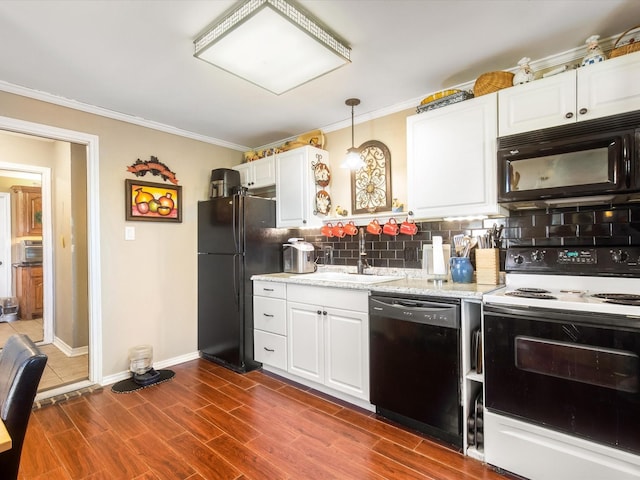 kitchen featuring sink, black appliances, decorative light fixtures, dark hardwood / wood-style floors, and white cabinetry