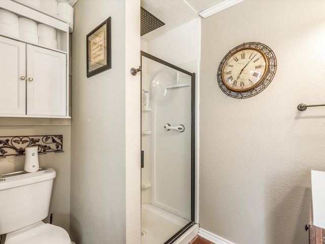 bathroom with toilet and walk in shower