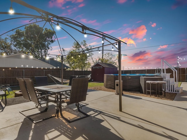 patio terrace at dusk with a shed