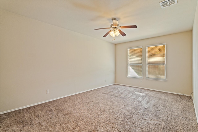 carpeted empty room featuring ceiling fan