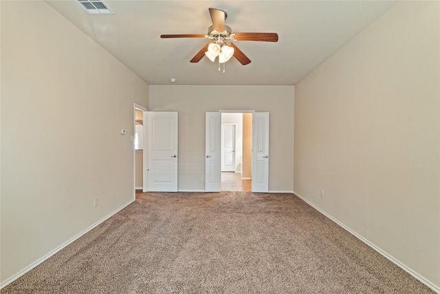 unfurnished bedroom with ceiling fan and light carpet