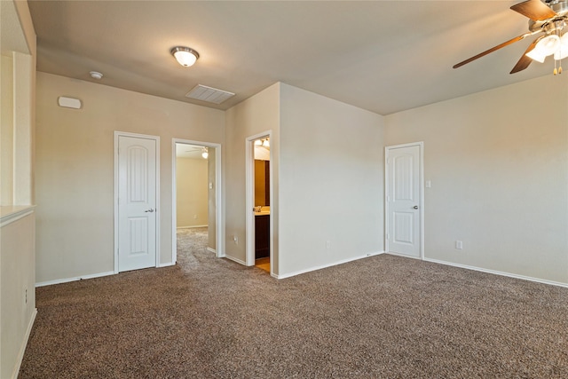 spare room featuring carpet flooring and ceiling fan