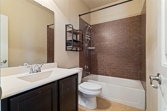 full bathroom with tile patterned flooring, tiled shower / bath combo, toilet, and vanity