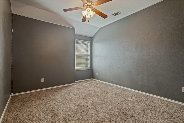 spare room with carpet flooring, ceiling fan, and lofted ceiling