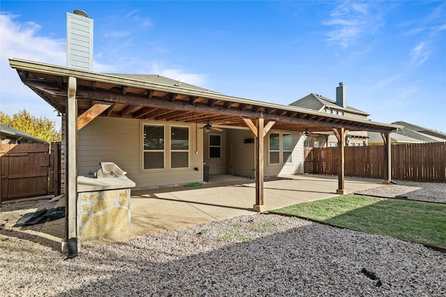 back of house featuring a patio area and ceiling fan