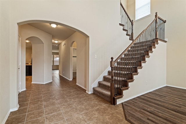 stairs featuring wood-type flooring