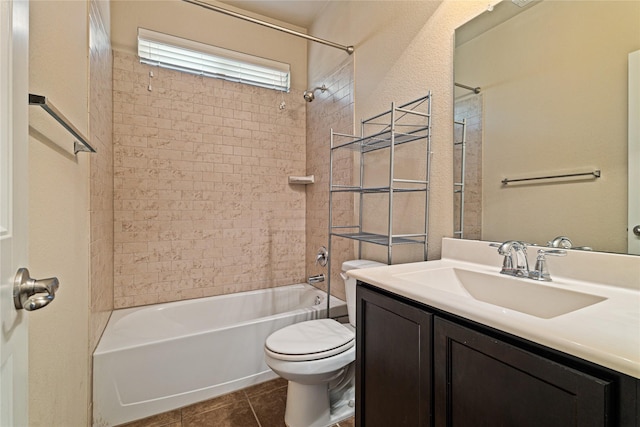 full bathroom with tile patterned flooring, vanity, toilet, and tiled shower / bath