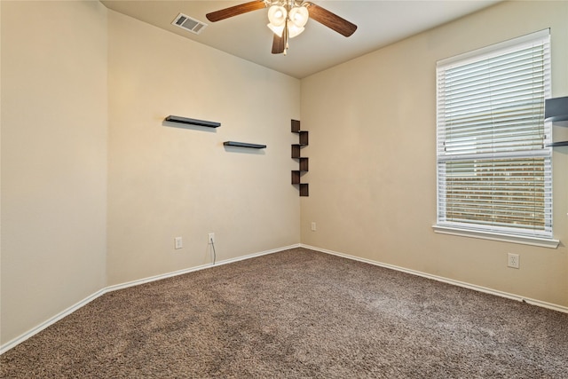 spare room with carpet and ceiling fan