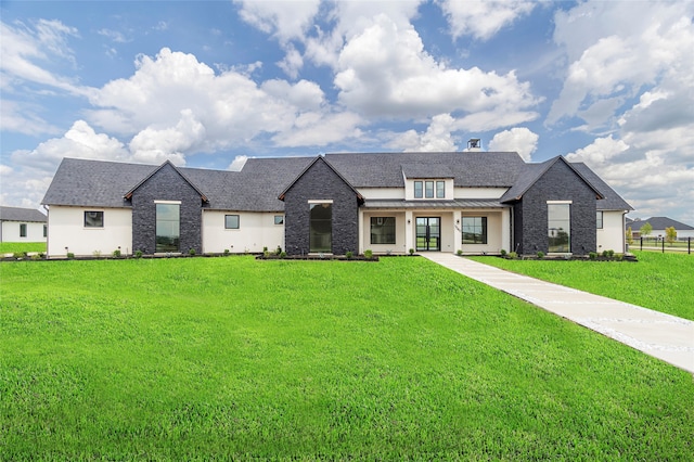 french country home with a front lawn