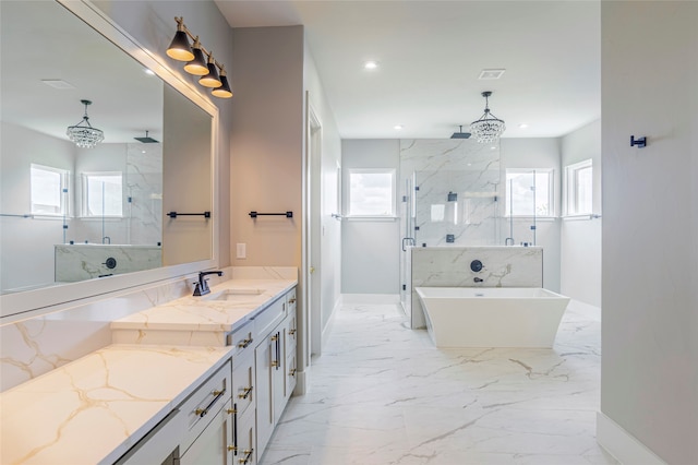 bathroom featuring vanity, a wealth of natural light, and independent shower and bath