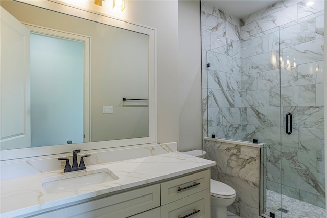 bathroom featuring walk in shower, vanity, and toilet