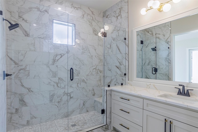 bathroom featuring vanity and a shower with shower door