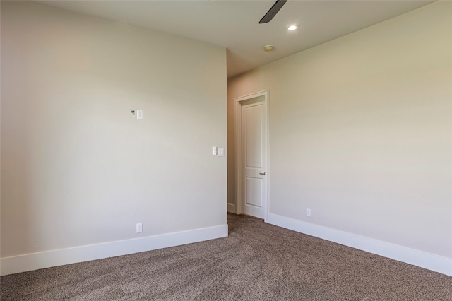 unfurnished room featuring ceiling fan and carpet floors