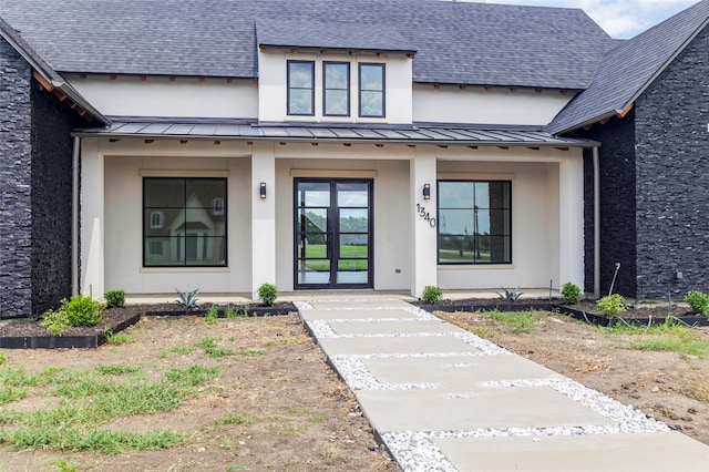 doorway to property featuring french doors and a porch