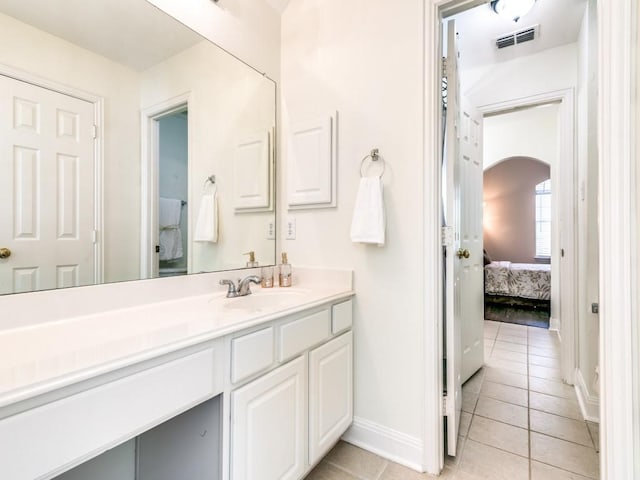 bathroom with vanity and tile patterned floors