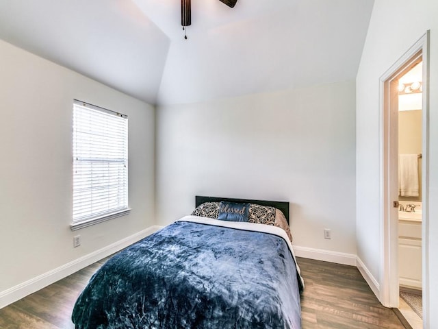 bedroom featuring connected bathroom, vaulted ceiling, dark hardwood / wood-style floors, and ceiling fan