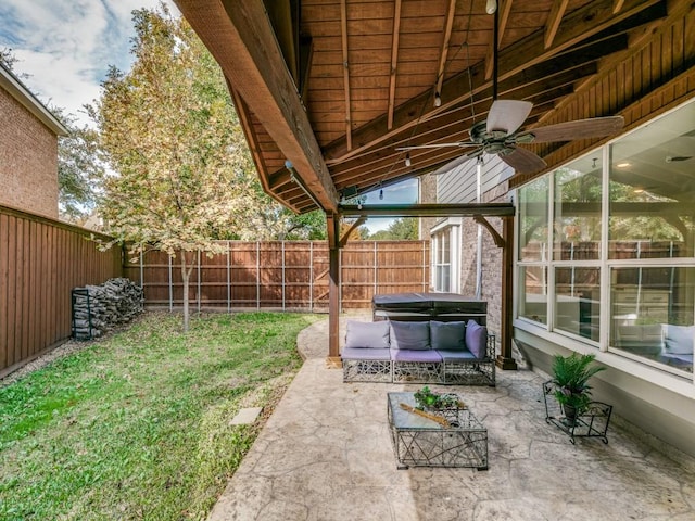 view of yard with an outdoor living space, a patio, and ceiling fan