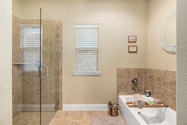 bathroom featuring independent shower and bath and tile patterned flooring