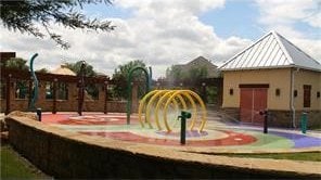 view of home's community featuring a playground