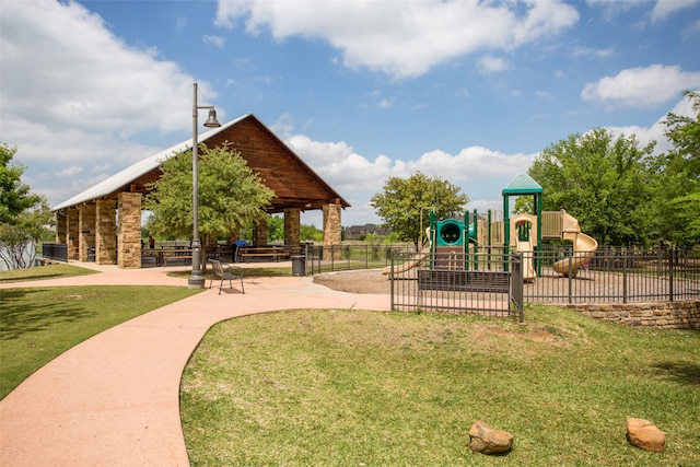 view of playground with a lawn