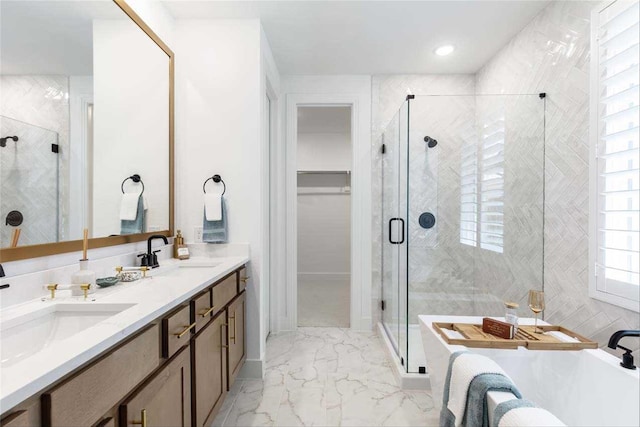 bathroom featuring vanity and separate shower and tub