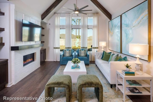 living room featuring lofted ceiling with beams, a brick fireplace, dark hardwood / wood-style floors, and ceiling fan