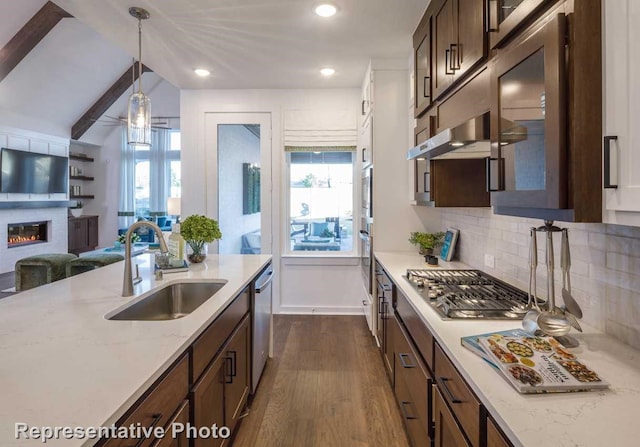 kitchen with pendant lighting, sink, plenty of natural light, and appliances with stainless steel finishes