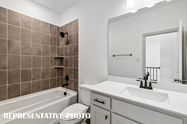 full bathroom featuring vanity, tiled shower / bath combo, and toilet