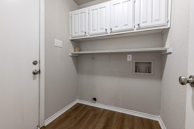 laundry room with electric dryer hookup, cabinets, dark wood-type flooring, and washer hookup