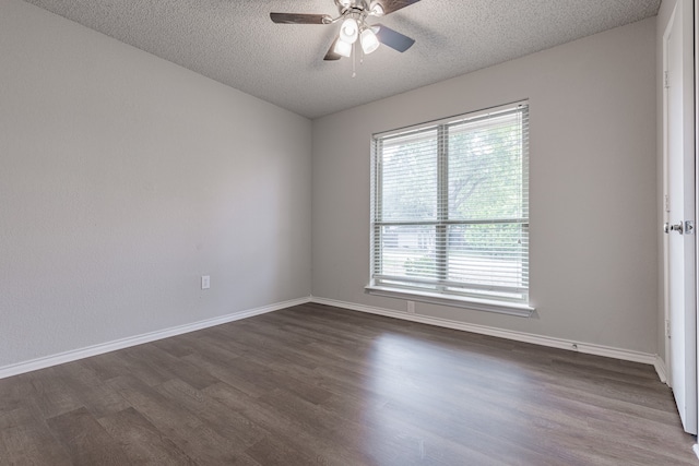 unfurnished room featuring a textured ceiling, dark hardwood / wood-style floors, and ceiling fan