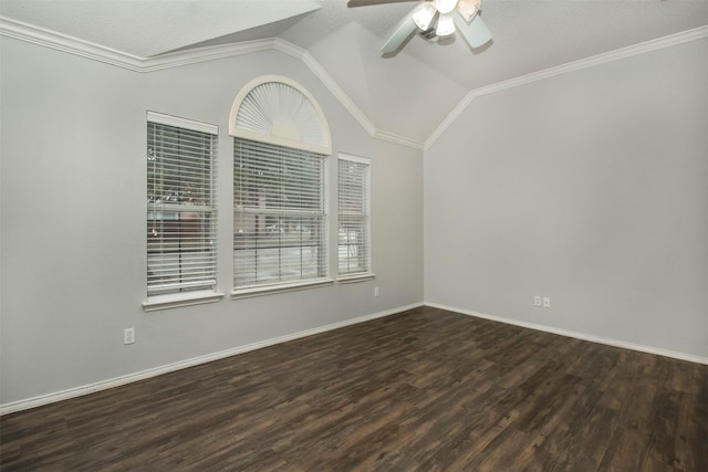 empty room featuring lofted ceiling, dark hardwood / wood-style flooring, ceiling fan, and crown molding