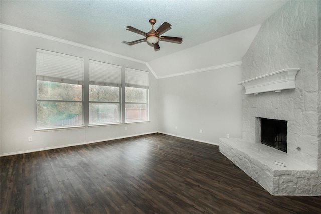 unfurnished living room featuring ceiling fan, dark hardwood / wood-style flooring, a textured ceiling, vaulted ceiling, and a fireplace