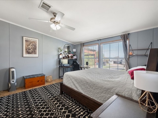 bedroom featuring ceiling fan and crown molding