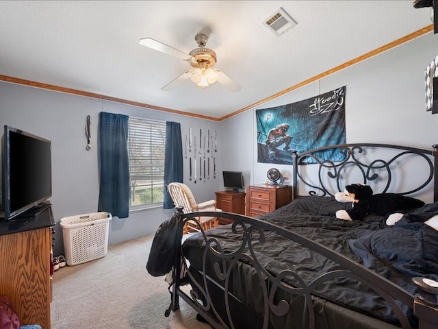 carpeted bedroom with ceiling fan and ornamental molding