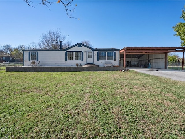 view of front facade with a front yard and a carport