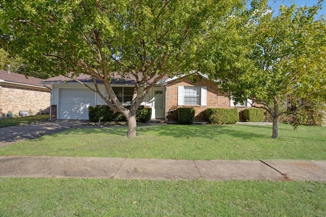 view of front of home with a garage and a front lawn