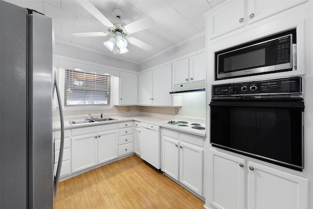 kitchen featuring stainless steel appliances, white cabinetry, ornamental molding, and sink