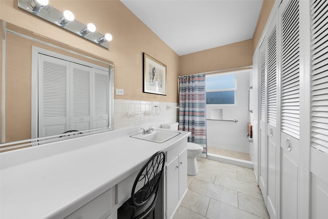 bathroom with tile patterned flooring, vanity, toilet, and a shower with curtain