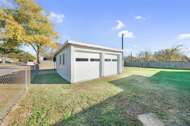 garage featuring a yard