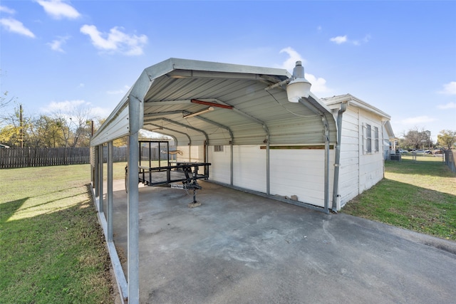 exterior space with a carport and a lawn