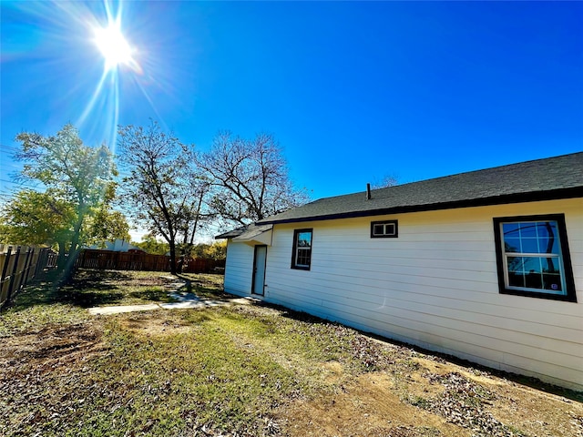 view of property exterior featuring a lawn