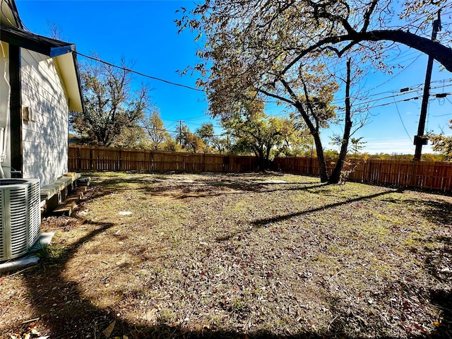 view of yard featuring central AC unit