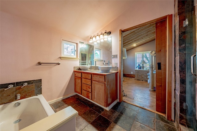 bathroom featuring vanity, independent shower and bath, and lofted ceiling