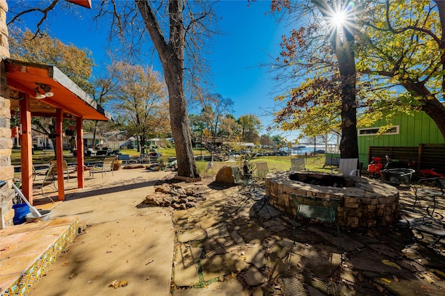 view of patio / terrace featuring an outdoor fire pit