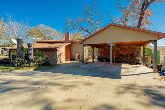 exterior space with a carport