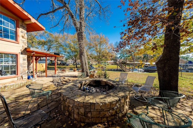 view of patio with an outdoor fire pit