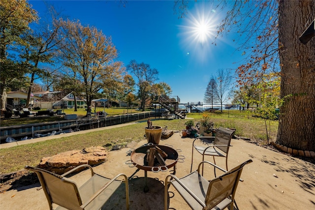 view of patio with a fire pit