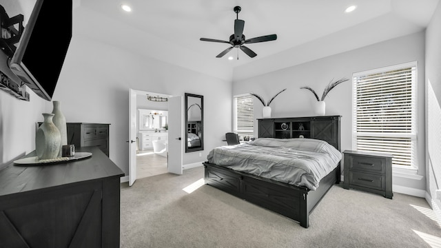 carpeted bedroom with ceiling fan and connected bathroom