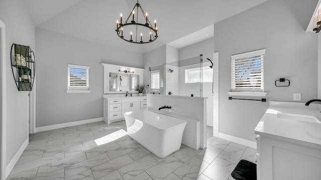 bathroom featuring vanity, plus walk in shower, and an inviting chandelier